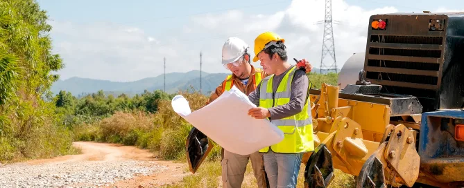Geotechnical engineer discussing with team member on what next steps in their ground compaction project will be